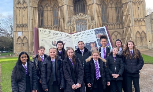 Students from Jack Hunt School standing outside Peterborough Cathedral.